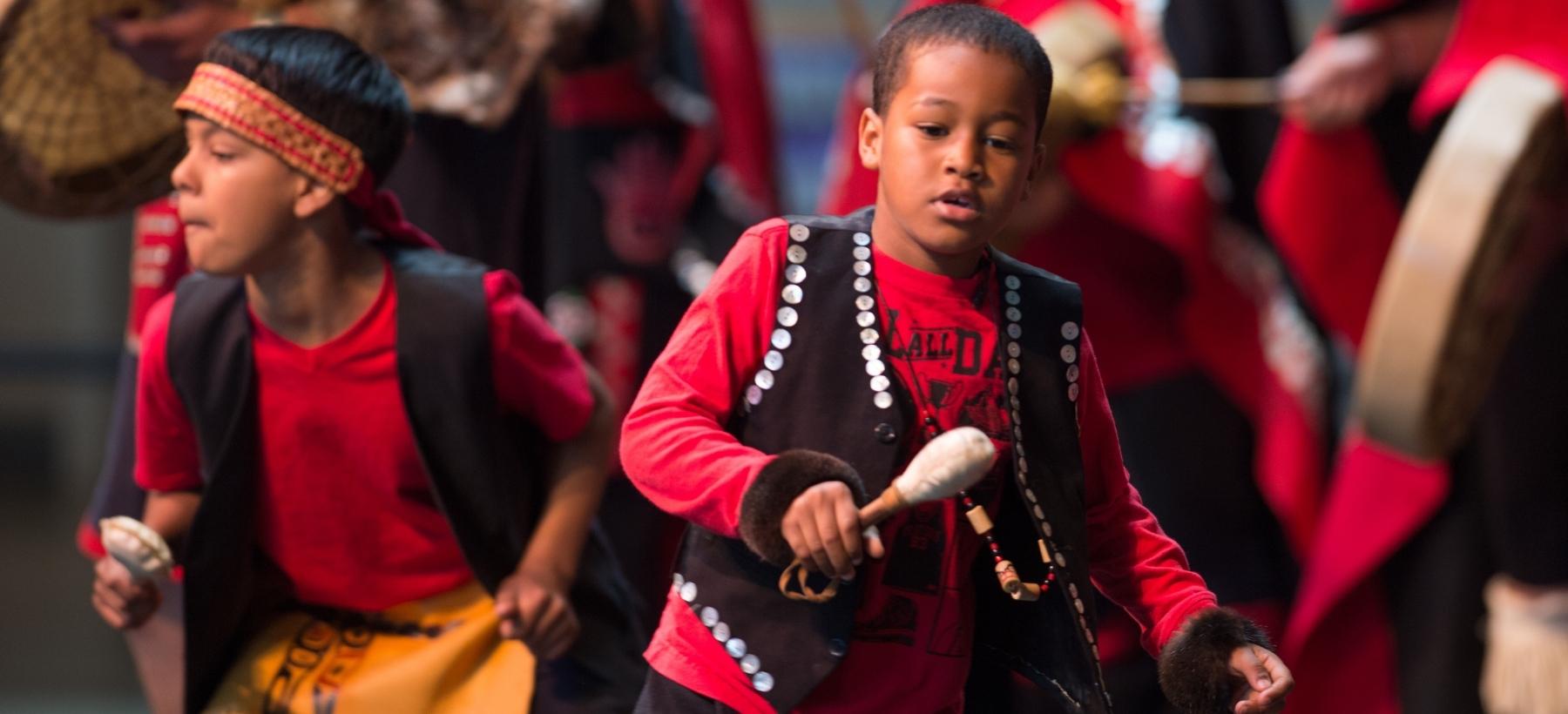 Photo of indigenous kids dressed in traditional clothing